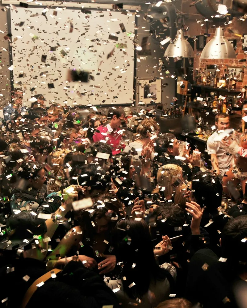 Confetti over a crowd at an event, sample photo